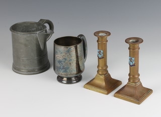 Of Horsham interest, a spouted pint measure marked H Flint Horsham 11cm, a silver plated tankard marked Crown Inn Horsham 10cm, a pair of gilt metal candlesticks decorated The Arms of Horsham (1 loose) 13cm 
