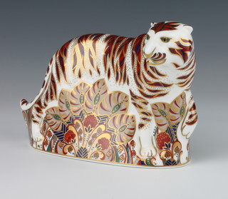 A Royal Crown Derby Imari pattern paperweight in the form of a Bengal tiger with silver stopper, 13cm, boxed 