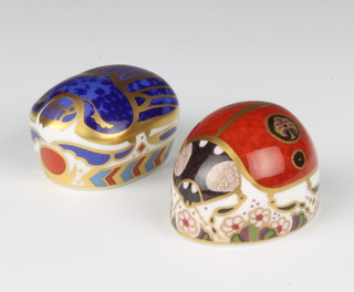 Two Royal Crown Derby Imari pattern paperweights - Millenium bug with gold stopper and Ladybird with silver stopper 5cm boxed 