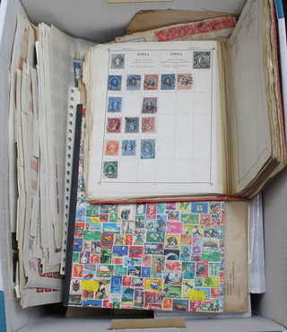 A Triumph album of various mint and used world stamps, a stock book of mint and used world stamps, a collection of sheets of Vatican stamps, various stamped envelopes and postcards 