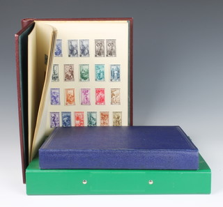A blue album of GB and Commonwealth stamps including one penny black, two two penny blues, a red Viking album of Italian mint and used stamps, a green album of used world stamps 