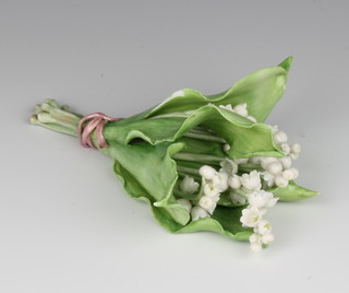 A Vladimir Kanevsky porcelain group of lily of the valley, tied with a ribbon, inscribed Vladimir for Dior 15cm 