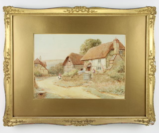 J S Kehey, watercolour signed, a Sussex lane with figures before a thatched cottage 24cm x 34cm 