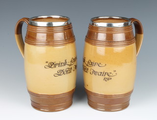 A pair of Doulton Lambeth jugs with silver collars - Drink faire, don't swaire 1760, 18cm, hallmark Chester 1902 