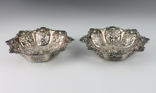 A pair of Victorian repousse and pierced silver octagonal bon bon dishes with floral decoration Birmingham 1899, 214 grams, 17cm 