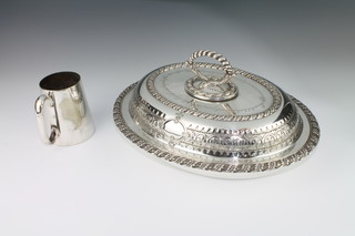 A Victorian silver plated repousse entree dish with presentation inscription and a do. mug 