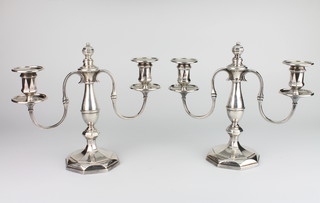 A pair of Art Deco silver 2 light candelabra with vase stems on octagonal bases, London 1930, maker Goldsmiths & Silversmiths Company 24cm