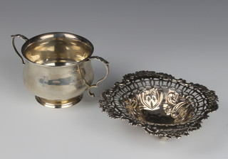 An Edwardian repousse pierced silver bon bon dish Birmingham 1906 12cm and a silver 2 handled bowl Birmingham 1914 18cm, 170 grams 