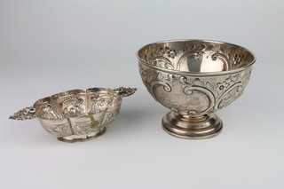 A 19th Century Dutch repousse silver brandy bowl with pierced handles and scroll decoration 18cm together a Victorian repousse silver rose bowl London 1894 15.5cm, 349 grams