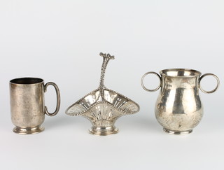 A silver mug with presentation inscription Chester 1917, 9cm, a 2 handled cup and a pierced basket 545 grams 