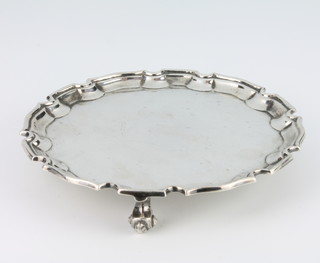 A Georgian style silver card tray with Chippendale rim and scroll feet London 1974, 237 grams, 15.5cm 