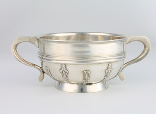 A silver 2 handled bowl with strap work decoration, Chester 1922, 231 grams, 16cm 