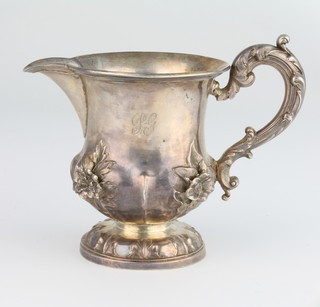 A William IV repousse silver jug with floral decoration and S scroll handle, London 1835, 132 grams, maker Edward. Edward Junior, John and William Barnard, 9cm 