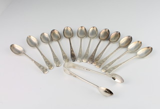 A set of 12 Victorian silver teaspoons and sugar nips with chased decoration, Sheffield 1897, 202 grams, cased 