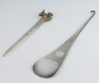 A silver paper knife with squirrel handle, Birmingham 1986 17.5cm together with a ditto button hook shoe horn, London 1920, 28.5cm , 200 grams
