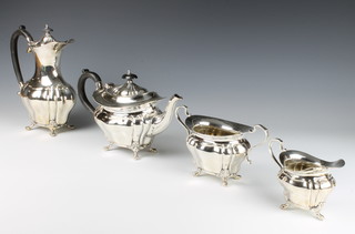 An Edwardian 4 piece silver plated tea and coffee set with ebony mounts on claw and ball feet 