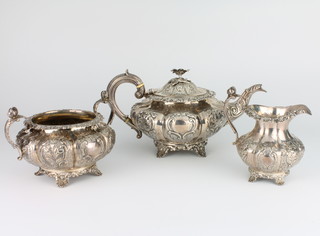 A William IV and Victorian repousse silver melon shaped tea set comprising teapot with floral finial, 2 handled sugar bowl and cream jug on shell feet, London 1837/1838, gross 1502 grams 