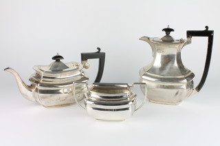 A hexagonal 3 piece silver tea and coffee set with ebony mounts, Birmingham 1928/1942, gross weight 1634 grams