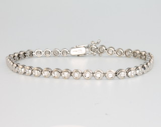 A Damiani 18ct white gold 42 stone brilliant cut diamond bracelet, 18cm 