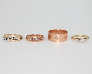 Four 9ct yellow gold gem set rings, size M, N, P and S 