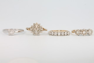 Four 9ct gold diamond set rings, sizes M, M, M and P 