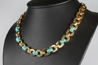 An 18ct yellow gold turquoise set necklace with open links together with a pair of matching ear clips 42.5cm, gross 82 grams 