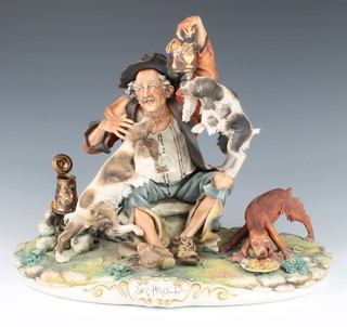 A Capodimonte group of a tramp with 3 dogs eating spaghetti indistinctly signed, 36cm 