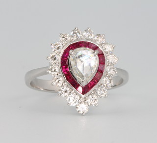 An 18ct white gold ruby and diamond cluster ring, the centre rose cut diamond approx. 0.27ct surrounded by rubies approx. 0.78ct and brilliant cut diamonds approx. 0.68ct size M 
