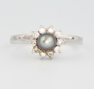 A 14ct white gold grey pearl and brilliant cut diamond cluster ring size P 