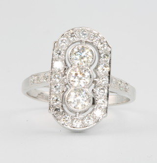 An 18ct white gold Art Deco style up finger ring comprising 3 brilliant cut diamonds, surrounded by brilliant cut diamonds approx. 0.90ct, size N