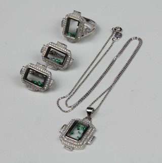An Art Deco style silver suite of jewellery comprising earrings, ring and pendant with floating stones