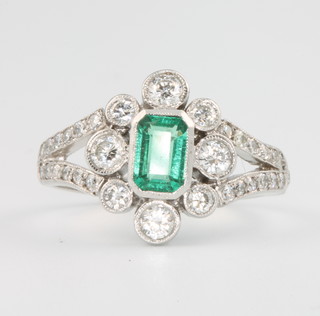An 18ct white gold Edwardian style emerald and diamond ring size N 