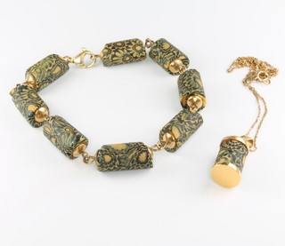 An 18ct yellow gold mounted bracelet set with African glass trading beads 20cm, a do. single trading bead mounted as a pendant hung on an 18ct gold chain 
