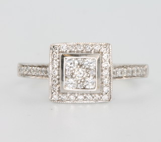 An 18ct white gold Art Deco style diamond ring, size M 1/2 
