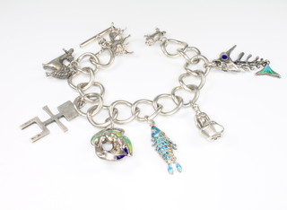 An 800 standard large link charm bracelet with 8 charms, 128 grams