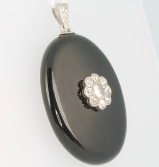 A Victorian onyx and diamond set mourning pendant set with 9 brilliant cut diamonds, 38mm x 30mm 