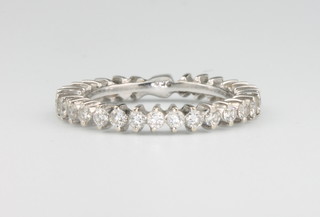 An 18ct white gold full eternity ring size L