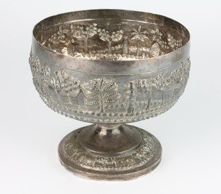 An Indian repousse silver pedestal bowl with an extensive scene of figures and buildings, 429 grams 14cm 