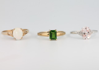 Three 9ct yellow gold gem set rings sizes Q, Q and S 