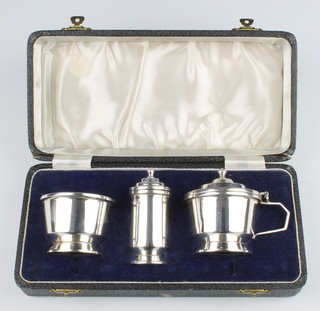 A silver 3 piece condiment set of tapered form Birmingham 1948, 182 grams 