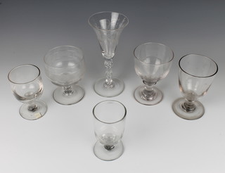 An Edwardian glass wine with chased swags and festoons with an air twist stem 19cm, 5 19th Century and later glasses