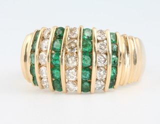 A 14ct yellow gold emerald and diamond cocktail ring size O 1/2