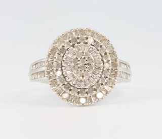 A 14ct white gold diamond cluster ring comprising baguette and brilliant cut stones size S 