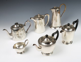 An Edwardian plated jug with patent lid, a 3 piece tea and coffee set, 2 teapots, 