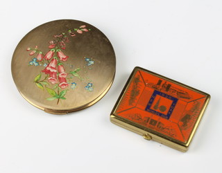 A 1939 New York World Fair compact 6cm, a Stratton floral decorated compact