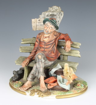 A capodimonte tramp sitting on a bench by Cortese 21cm