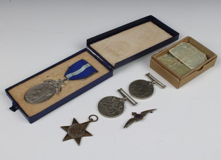 A Victorian Masonic charity jewel a silver mount, a pin badge and a WWII trio to F/LT. J.V.MIDWINTER comprising 1939-45 star, defence medal and British war medal in original posting box 