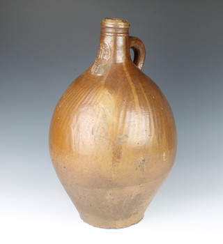 A 19th Century Continental Bellarmine jug with naive mask 43cm 