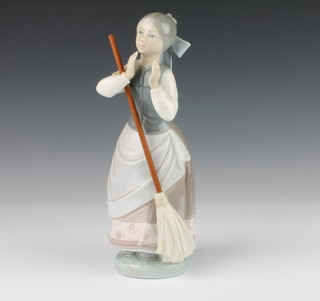 A Lladro figure of a standing girl with broom 23cm 
