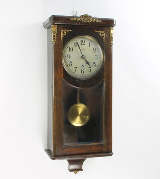 Vedette, a French Art Deco 8 day chiming wall clock with 19cm silvered dial having Roman numerals, contained in a mahogany and gilt mounted case 